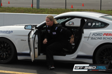 Dana Tomisek, West Financial Services Director of IT & Client Services entering a sports car
