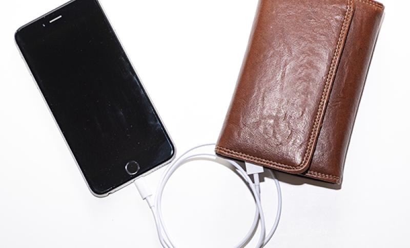 Smart phone tethered to traditional wallet. West Financial Services, Inc.