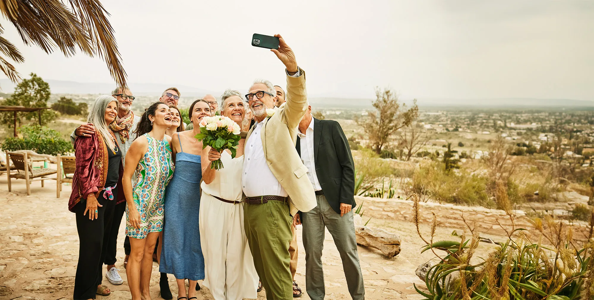 Family taking selfie at wedding