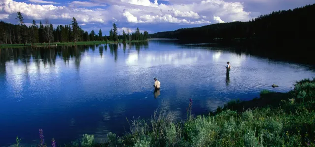 Beautiful lake surrounded by mountains. West Financial Services.