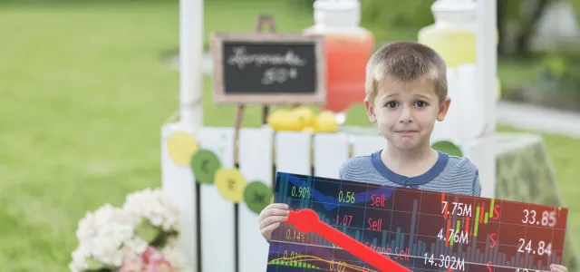 Kid in front of a lemonade stand. Kid holding price chart. West Financial Services.