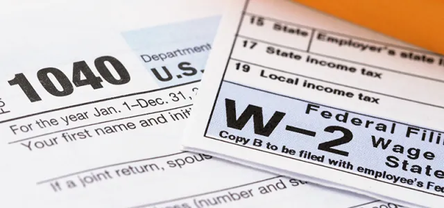 An image of IRS forms 1040 and W-2. West Financial Services.